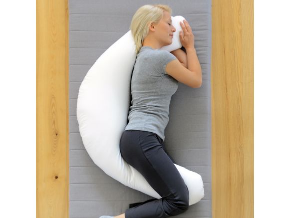Femme allongée sur le côté avec le coussin de positionnement SISSEL® COMFORT Femme allongée sur le côté avec le coussin de positionnement SISSEL® COMFORT