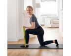 Femme sur un tapis avec anneau élastiques SISSEL® X-Tension Ring jaune